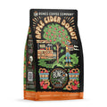 The front of a 12 ounce bag of Bones Coffee Company Apple Cider Donut coffee. Its flavor is apple cider donut, and it has a skeleton picking apples on the art.