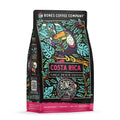 The front of a 12 ounce bag of Bones Coffee Company Costa Rica single-origin coffee. It is a medium roast, and it has a toucan standing on a branch with leaves scattered around it on the art.