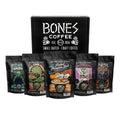 Five bags of four ounces of flavored coffee. From left to right their names are Frankenbones, Apple Cider Donut, Frosted Pumpkin Roll, Blackberry Cobbler, and Jacked o Lantern. A box is behind it that says Bones Coffee. There is a sun above them that says Fall Favorites.