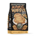 A bag of Bones Coffee Company Maple Waffle medium roast coffee, featuring a black packaging design with a detailed illustration of maple waffles on a white plate and a cartoon skeleton logo.