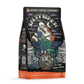 The front of a 12 ounce bag of Bones Coffee Company Salty Siren coffee. Its flavor is sea salted caramel mocha, and it has a skeleton dressed up as a sailor holding a mermaid on the art.
