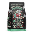 The front of a 12 ounce bag of Bones Coffee Company White Chocolate Peppermint Bark coffee. Its flavor is white chocolate peppermint bark. It has skeletons dressed as Santa in a peppermint cane field on the art.