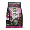 The front of a 12 ounce bag of Bones Coffee Company Blackberry Cobbler coffee. Its flavor is blackberry cobbler, and it has a skeleton dog and grandma with a blackberry cobbler on a windowsill on the art.